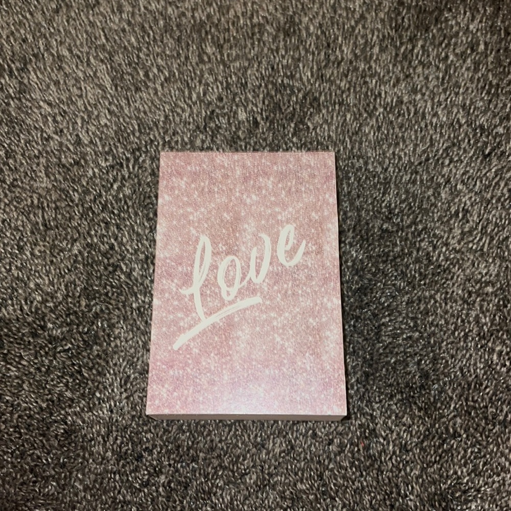 Pink hanging wall sign